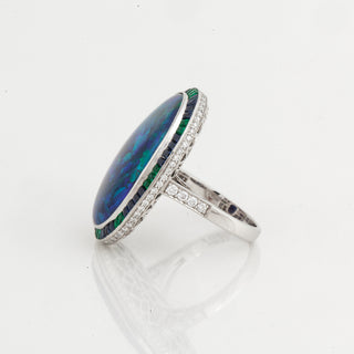 Estate Platinum Oval Black Opal Ring with Sapphire & Emerald Halo