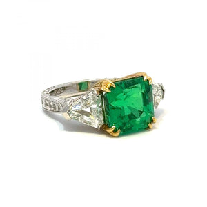 Platinum and 18K Gold Colombian Emerald Ring with Trillion Diamonds