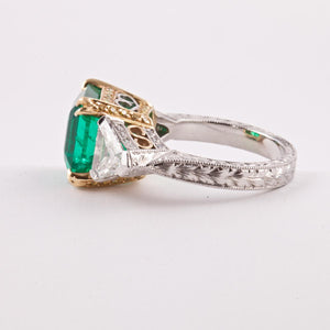 Platinum and 18K Gold Colombian Emerald Ring with Trillion Diamonds